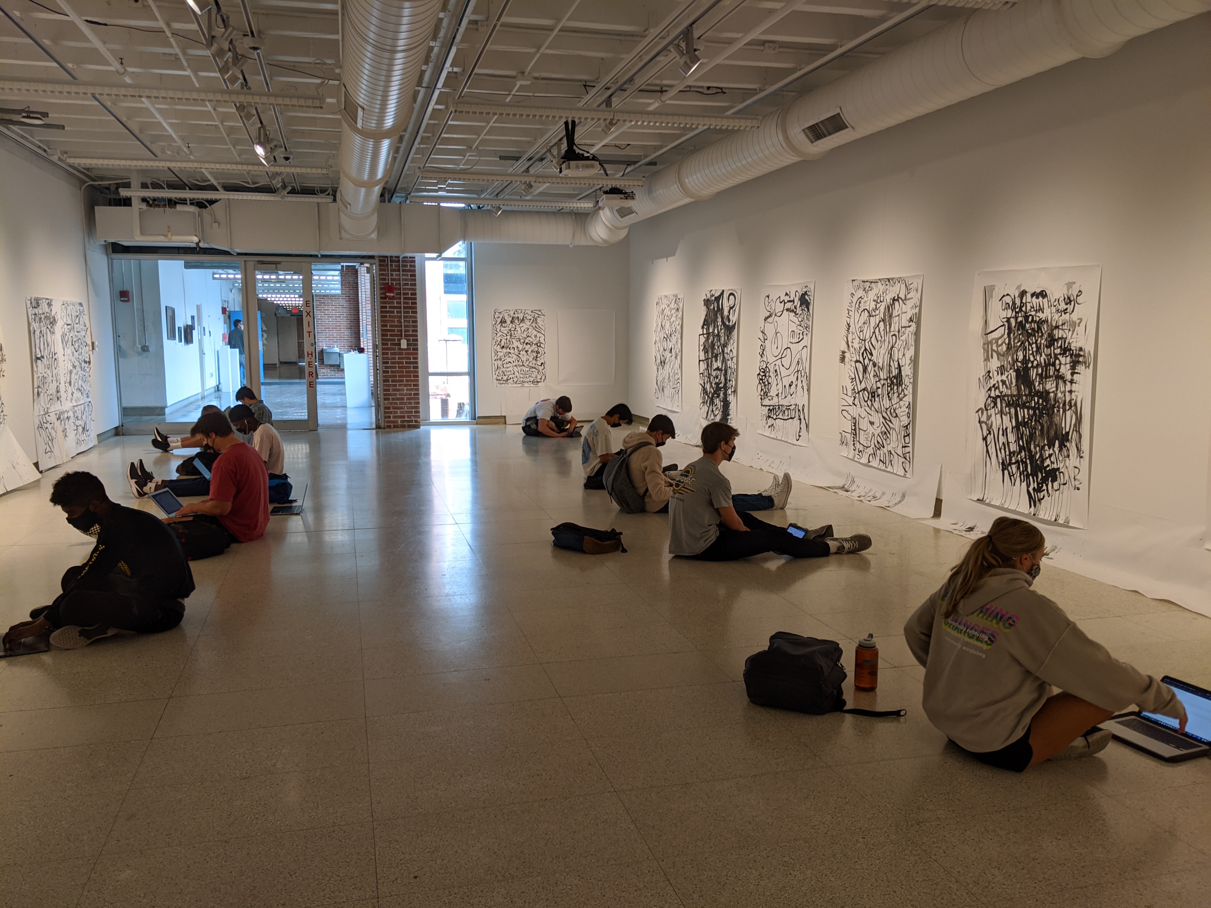 Students in Gallery reflecting on Rapid Fire Text 