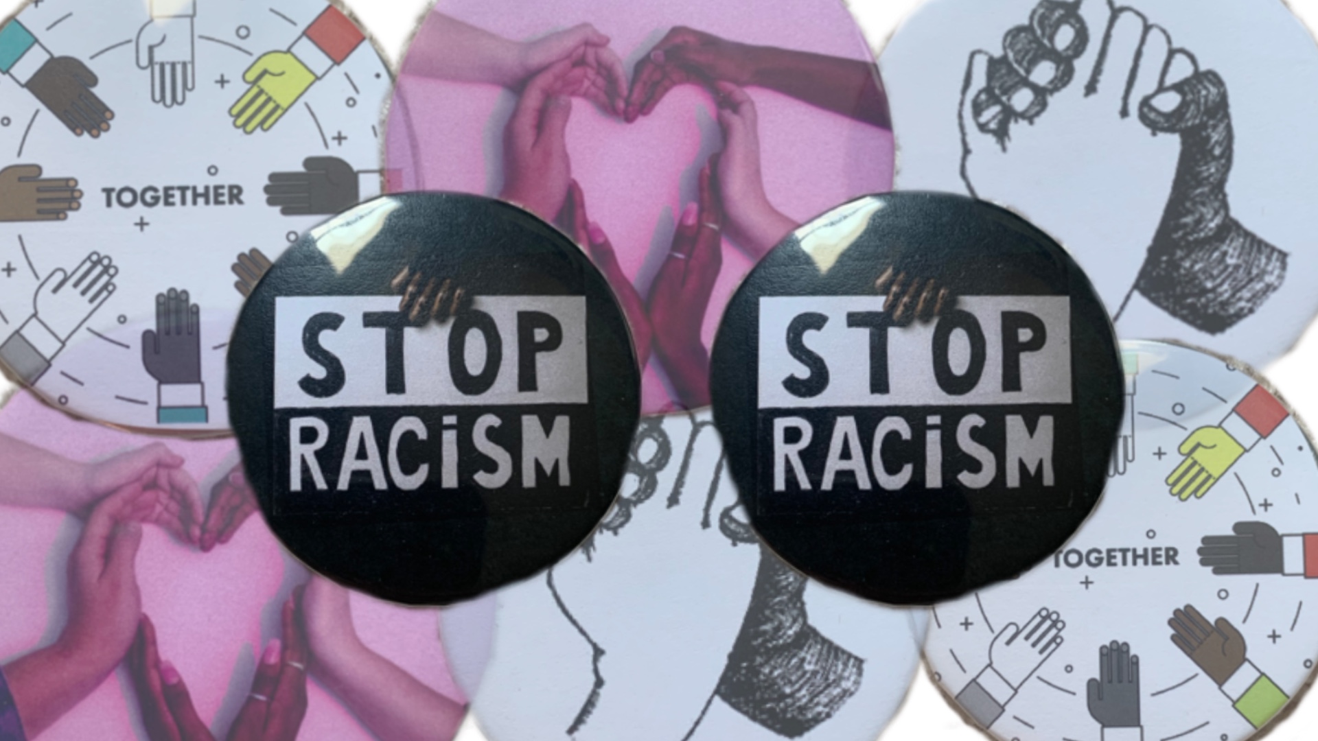 two buttons that sat "Stop Racism"