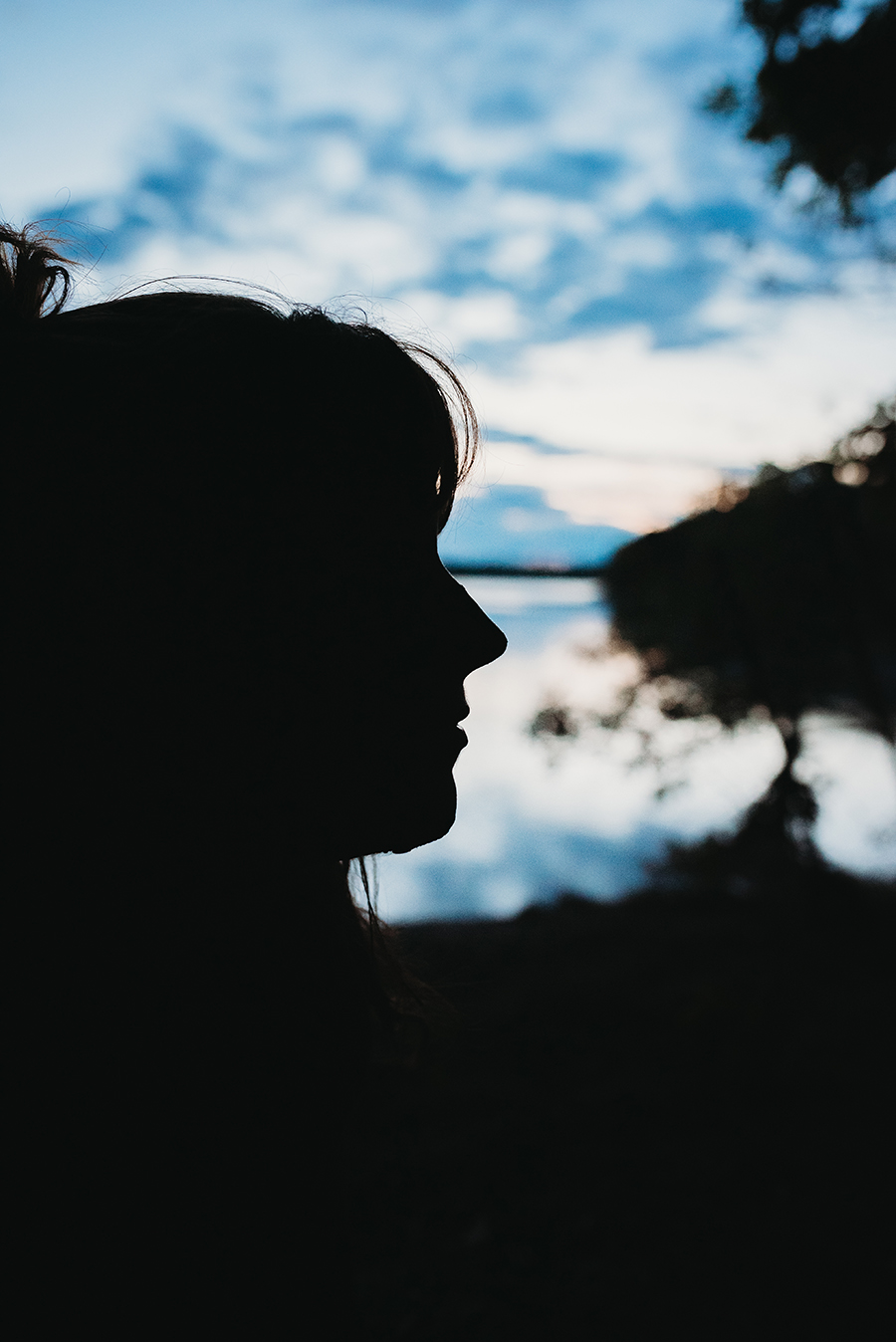 profile of a woman at riverbank 