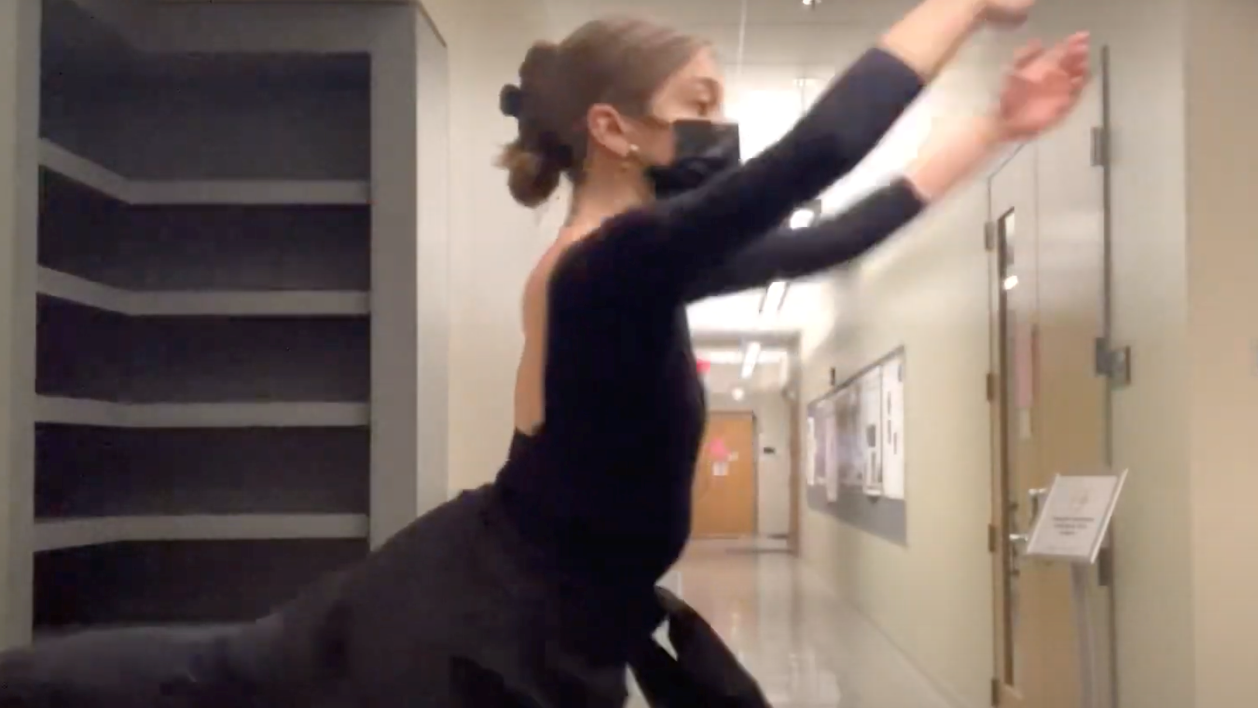 A dancer in a hallway.