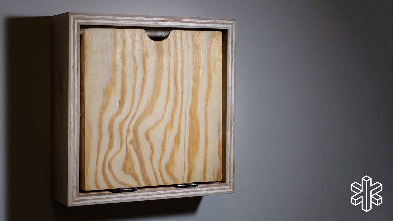 wooden box affixed to wall