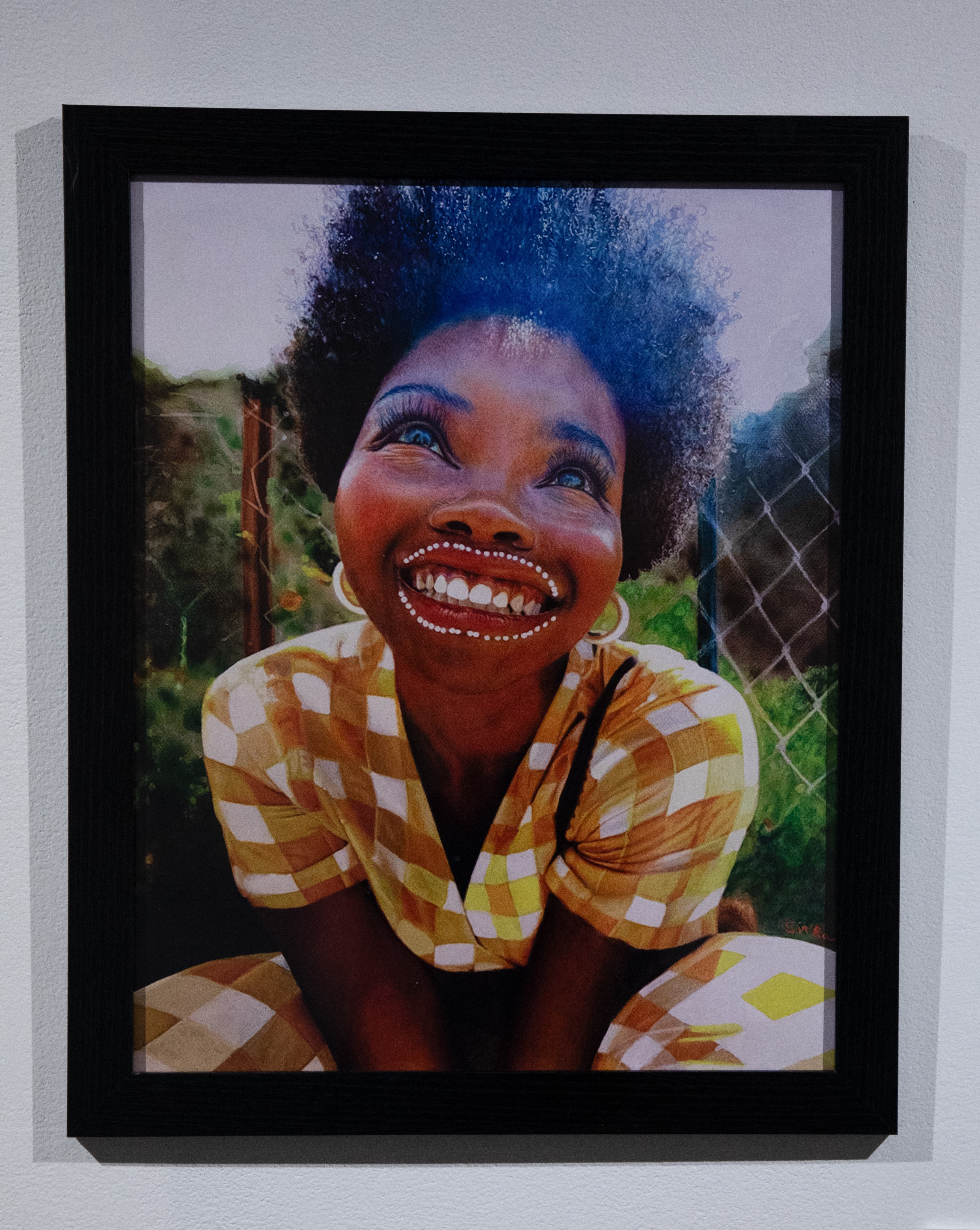 Print of an African American woman looking up and smiling in a seated position 