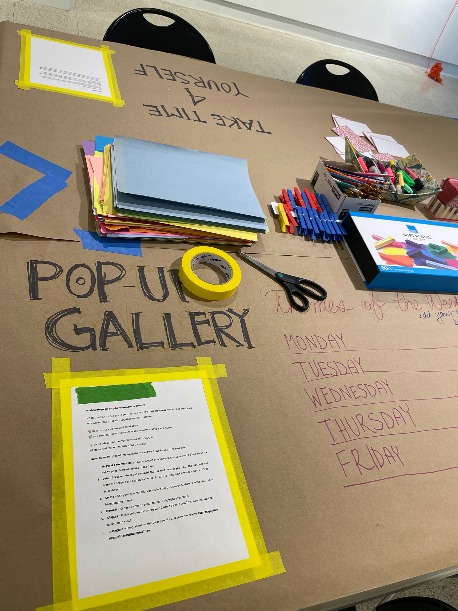 table with art supplies saying pop-up gallery