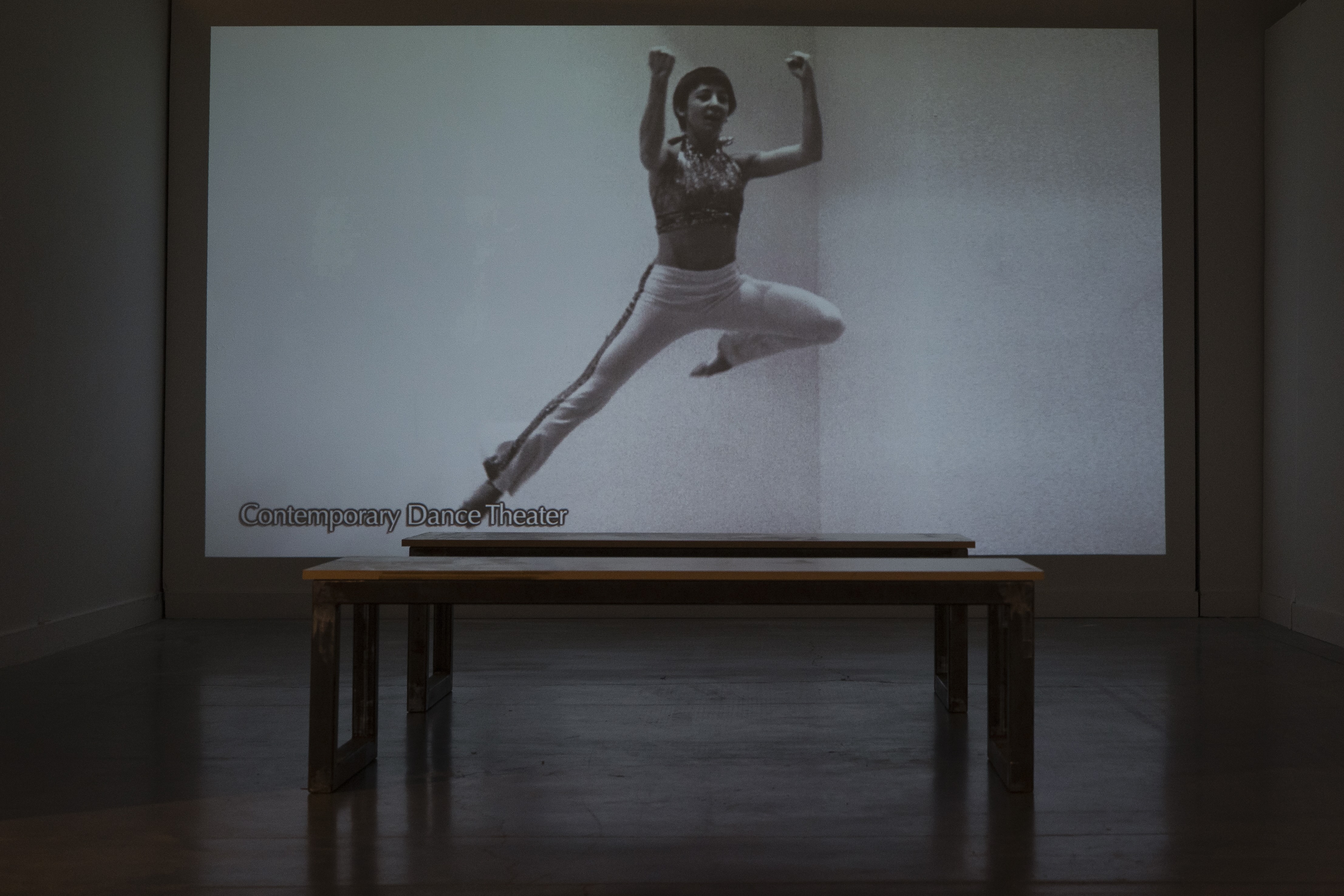 documentary film with a dancer leaping on screen