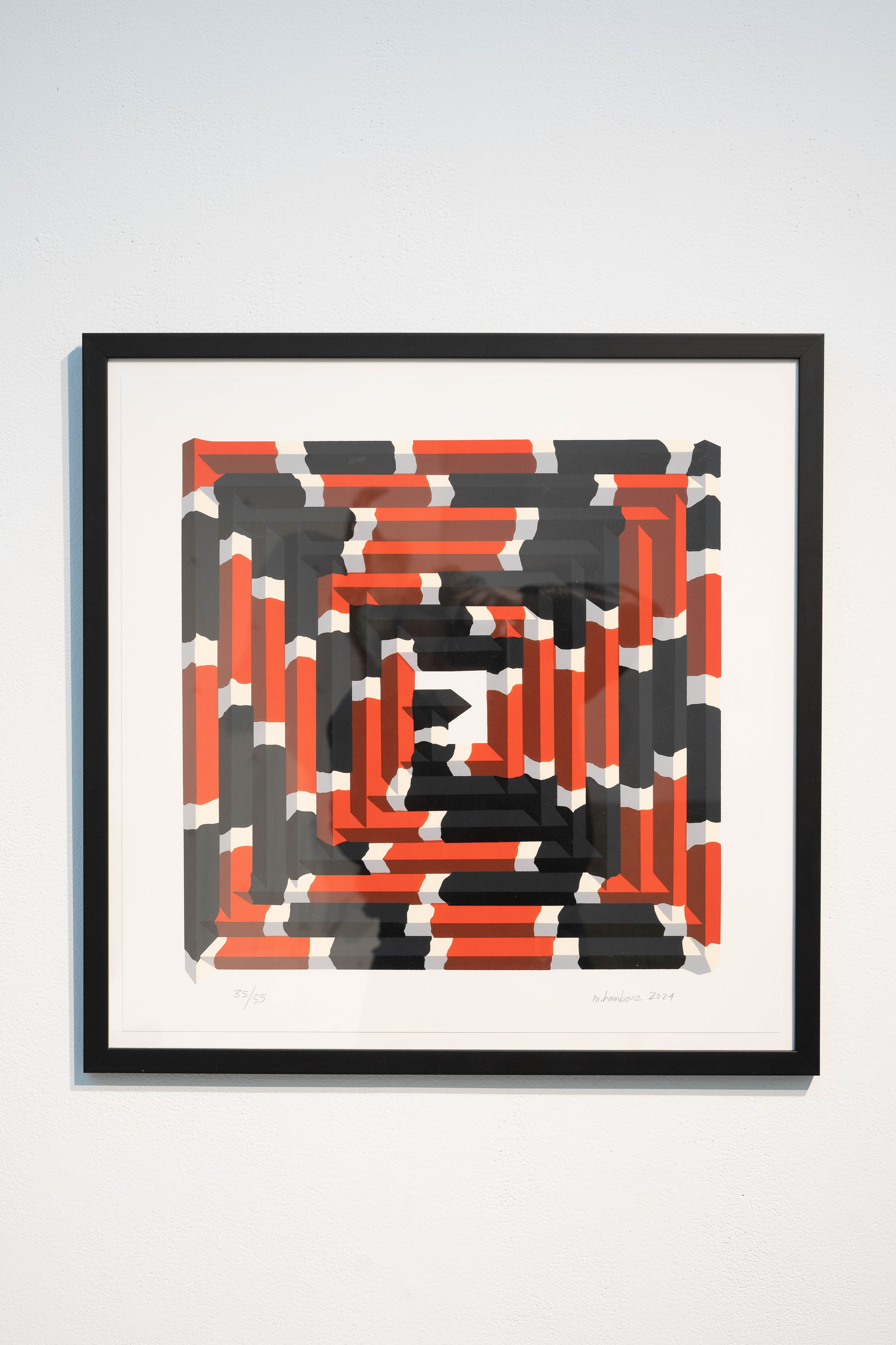 square pattern with snake-like coils in red, black, and white