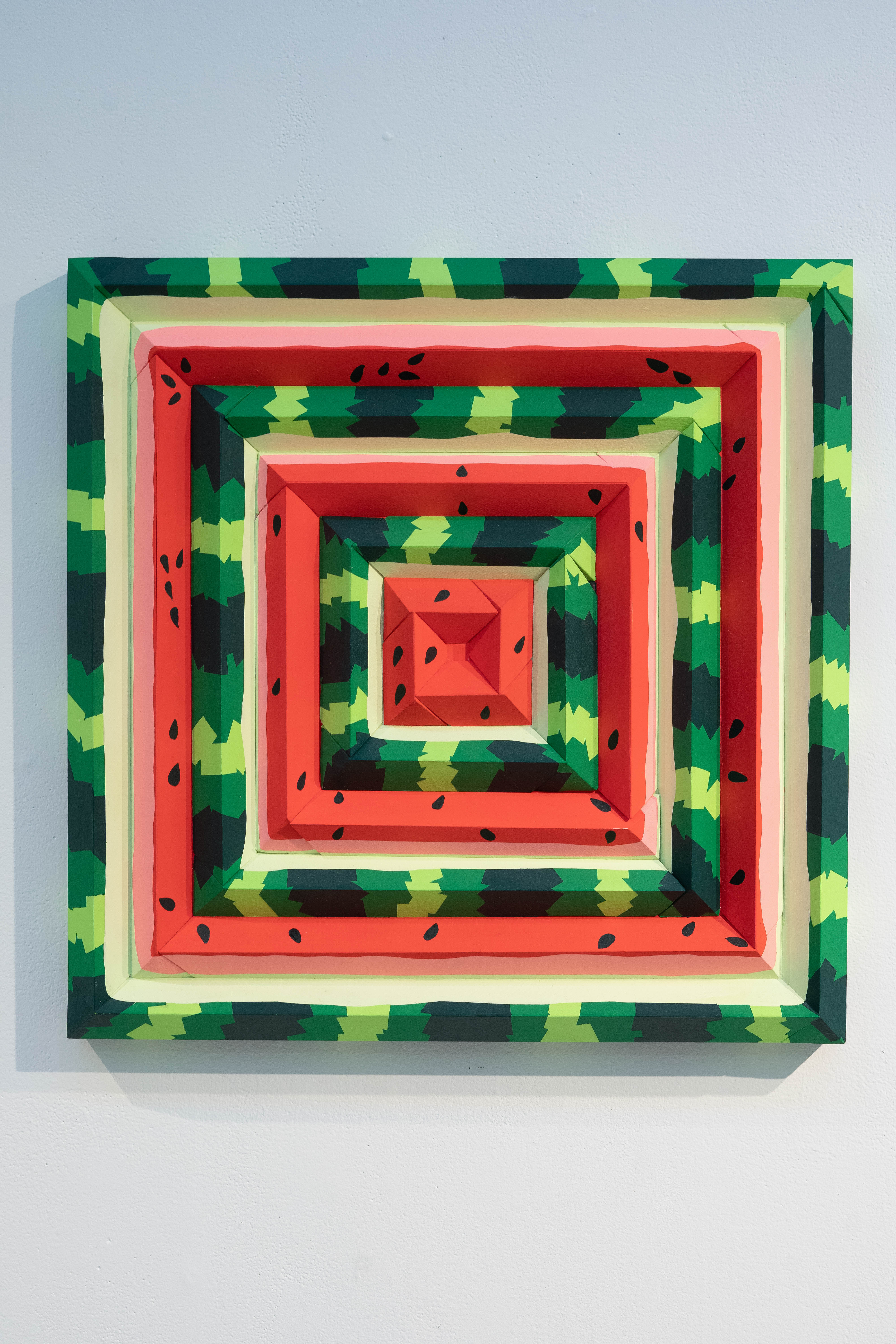 square painting that mimics the patterns and colors of a watermelon