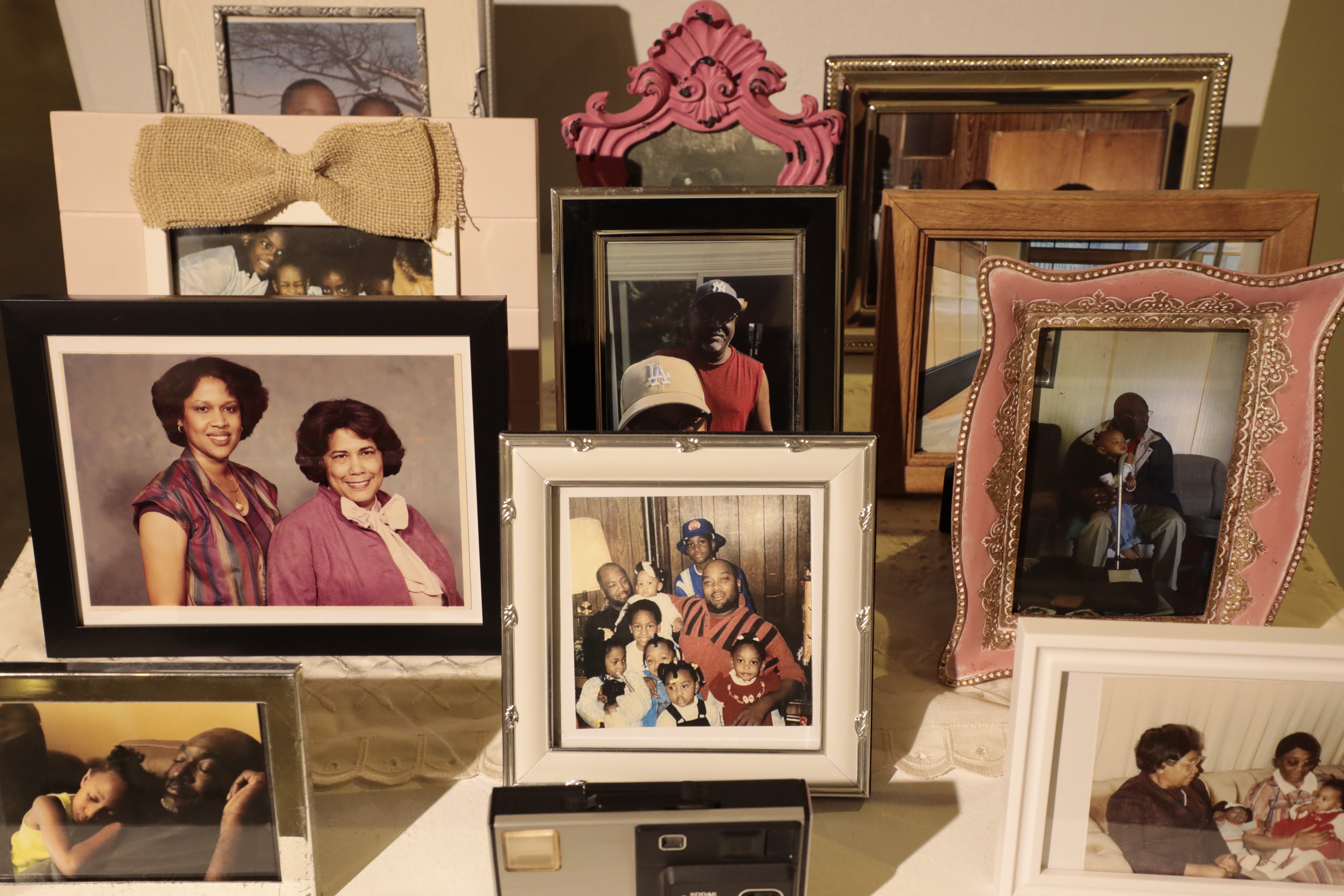 Multiple frames sit in front of and behind each other, depicting children with their family 