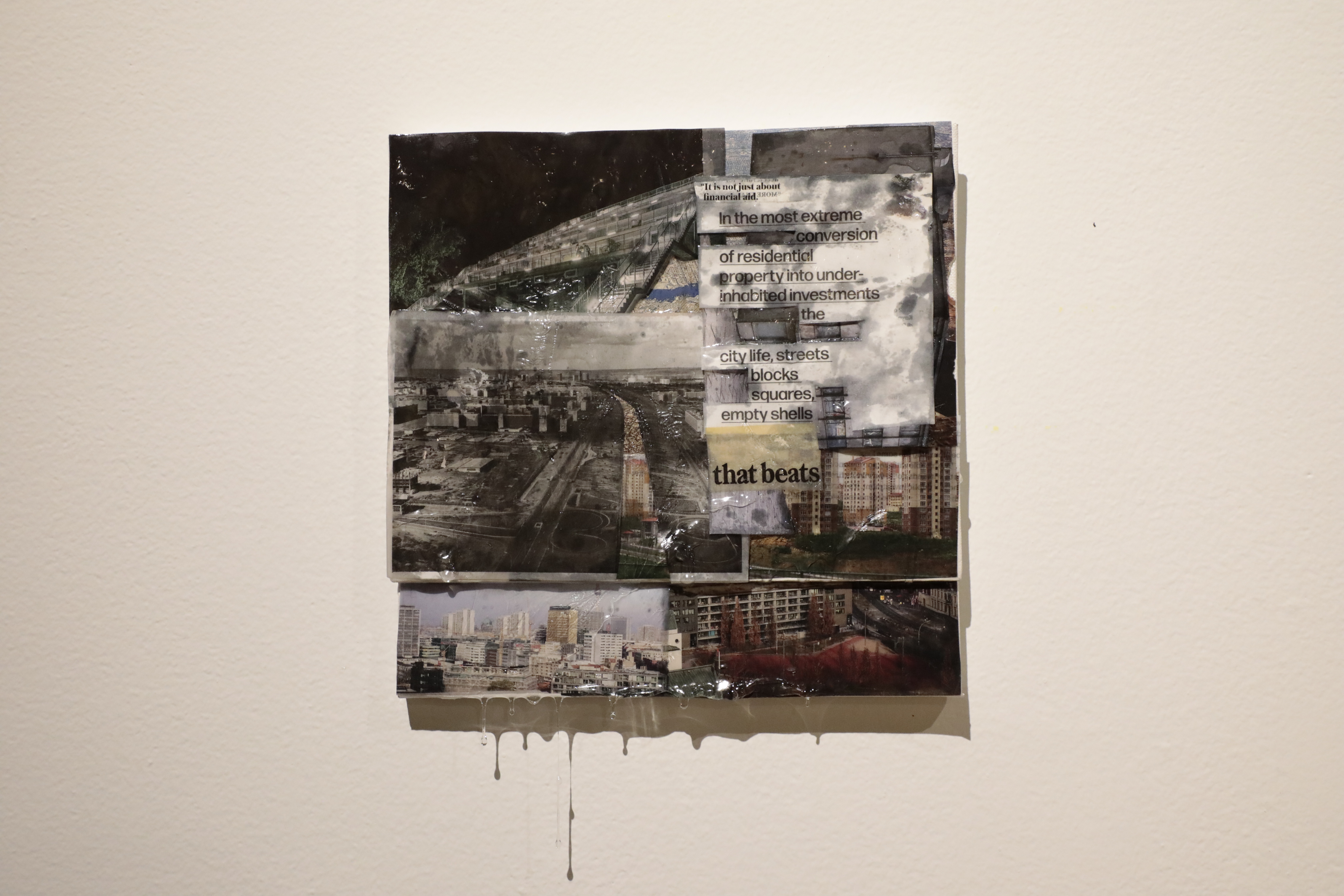 A square collage piece of city landscapes and text. 