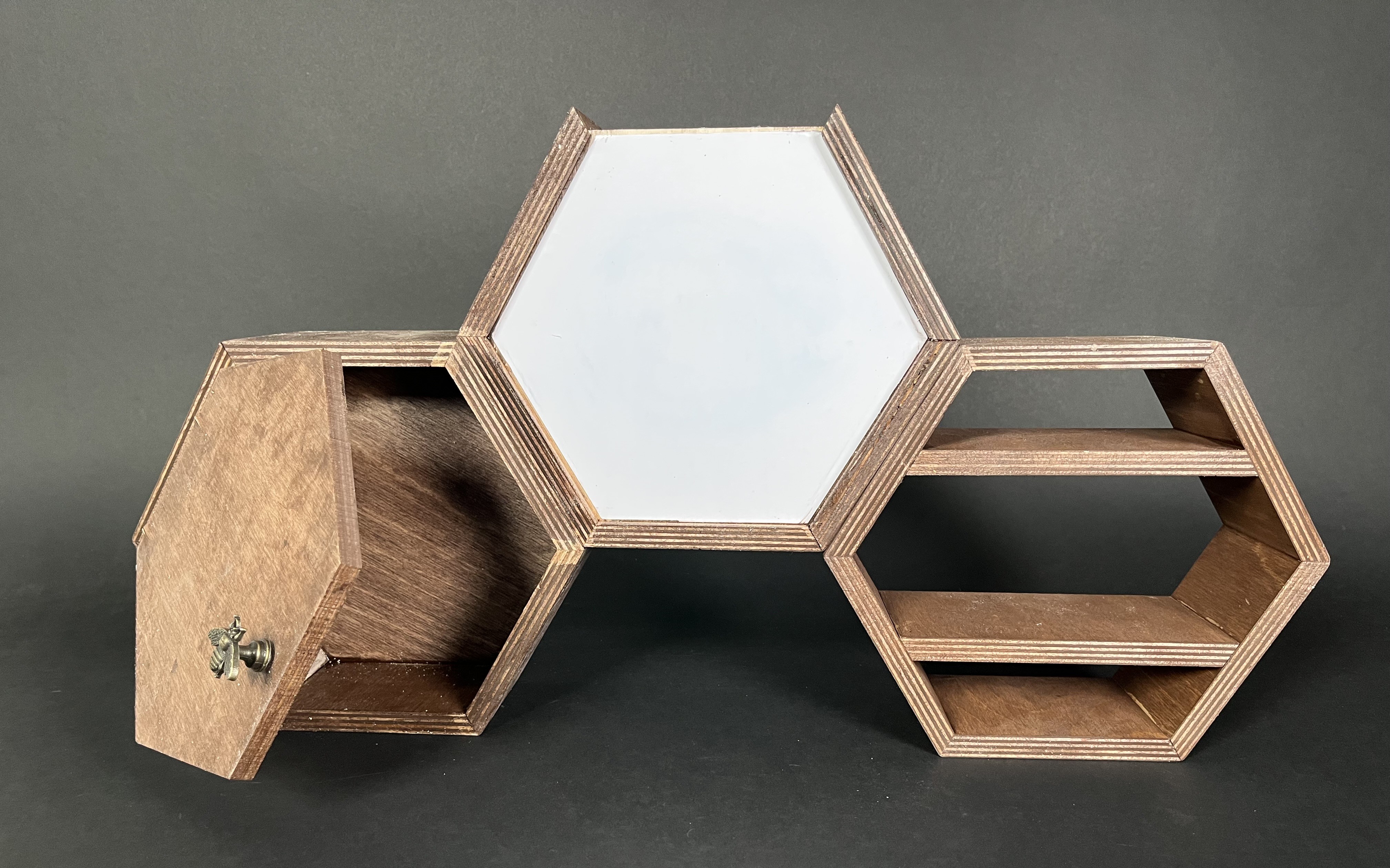 three hexagonal containers for a desk with a dry erase board and shelf and cabinet