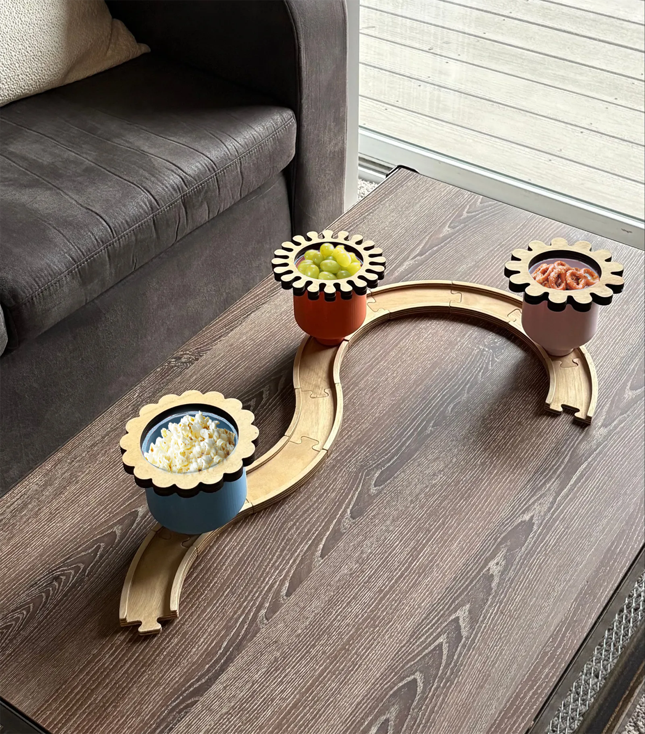 three colorful cups on a track for serving snacks