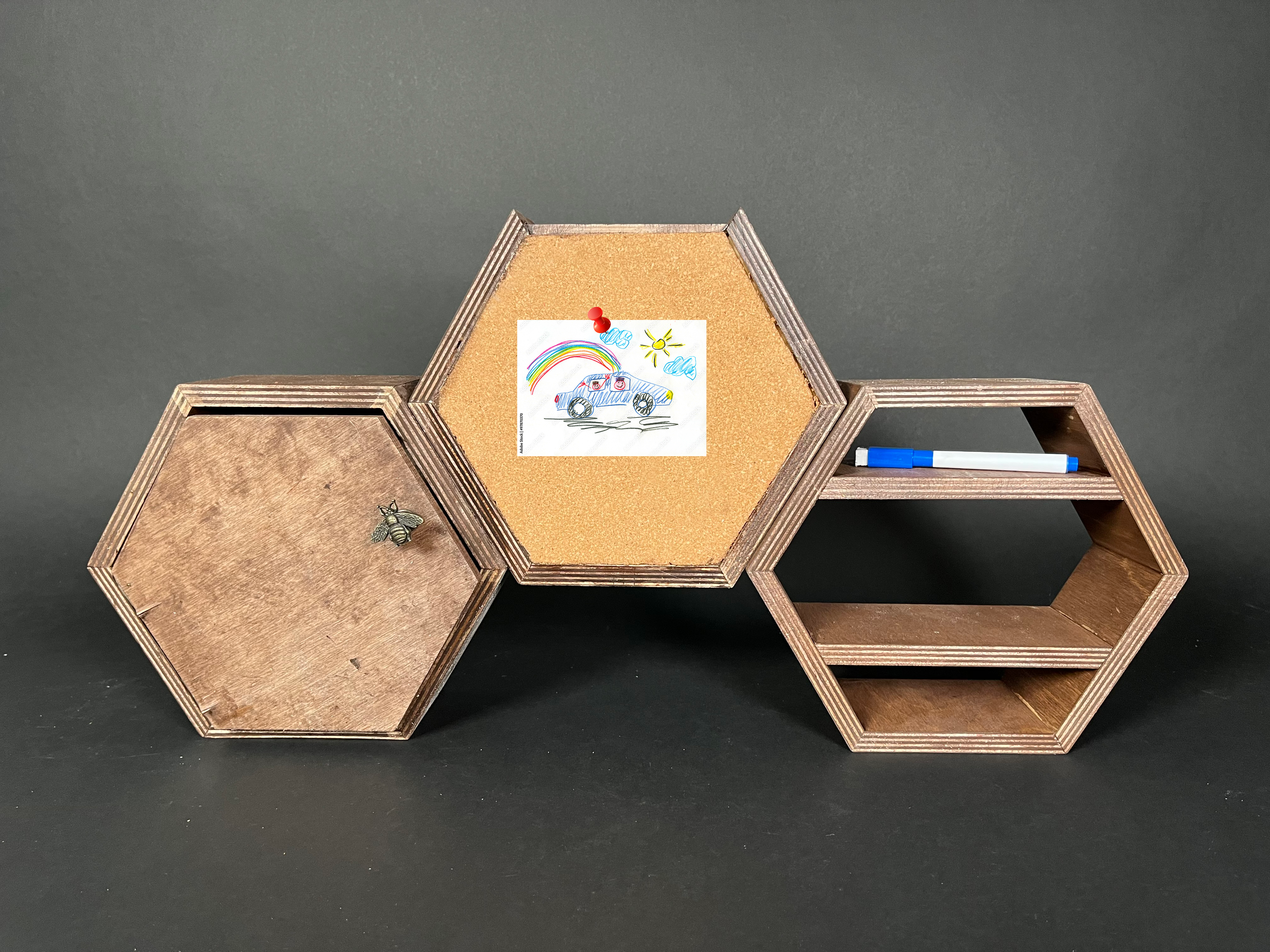 three hexagonal containers for a desk, with one as a corkboard and another as a layered desk