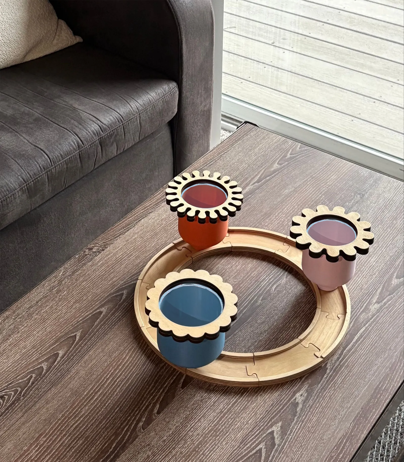 three colorful cups on a track for serving snacks