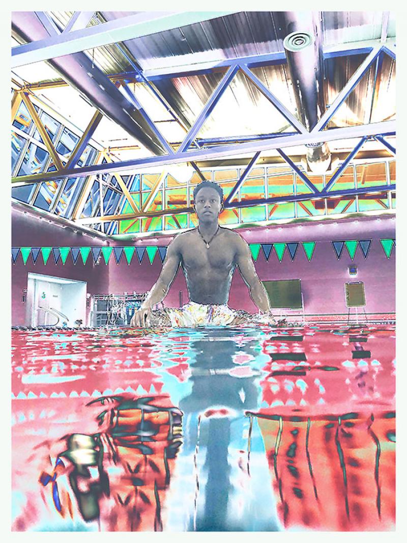 boy in pool with abstract colored filter over image