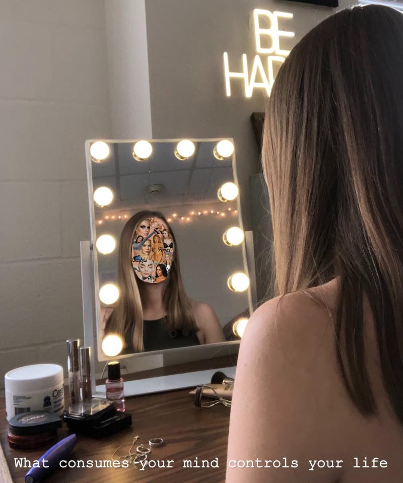 woman looking at her distorted reflection in mirror 