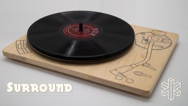 A record sits on a wood board that is illustrated to look like a record player.