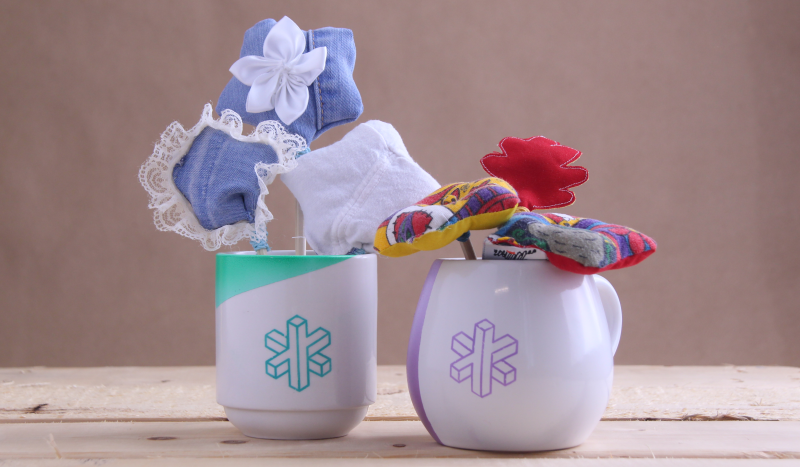 Mugs filled with tiny pillows on sticks