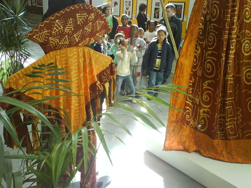 image of a group of youth getting a tour of our Midnight Robbers exhibition