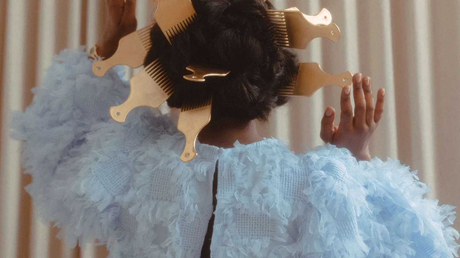 Woman facing backwards wearing blue
