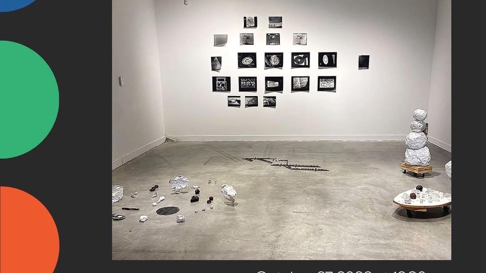 Installation view of Suzanne Silver's work against a black background with colorful dots