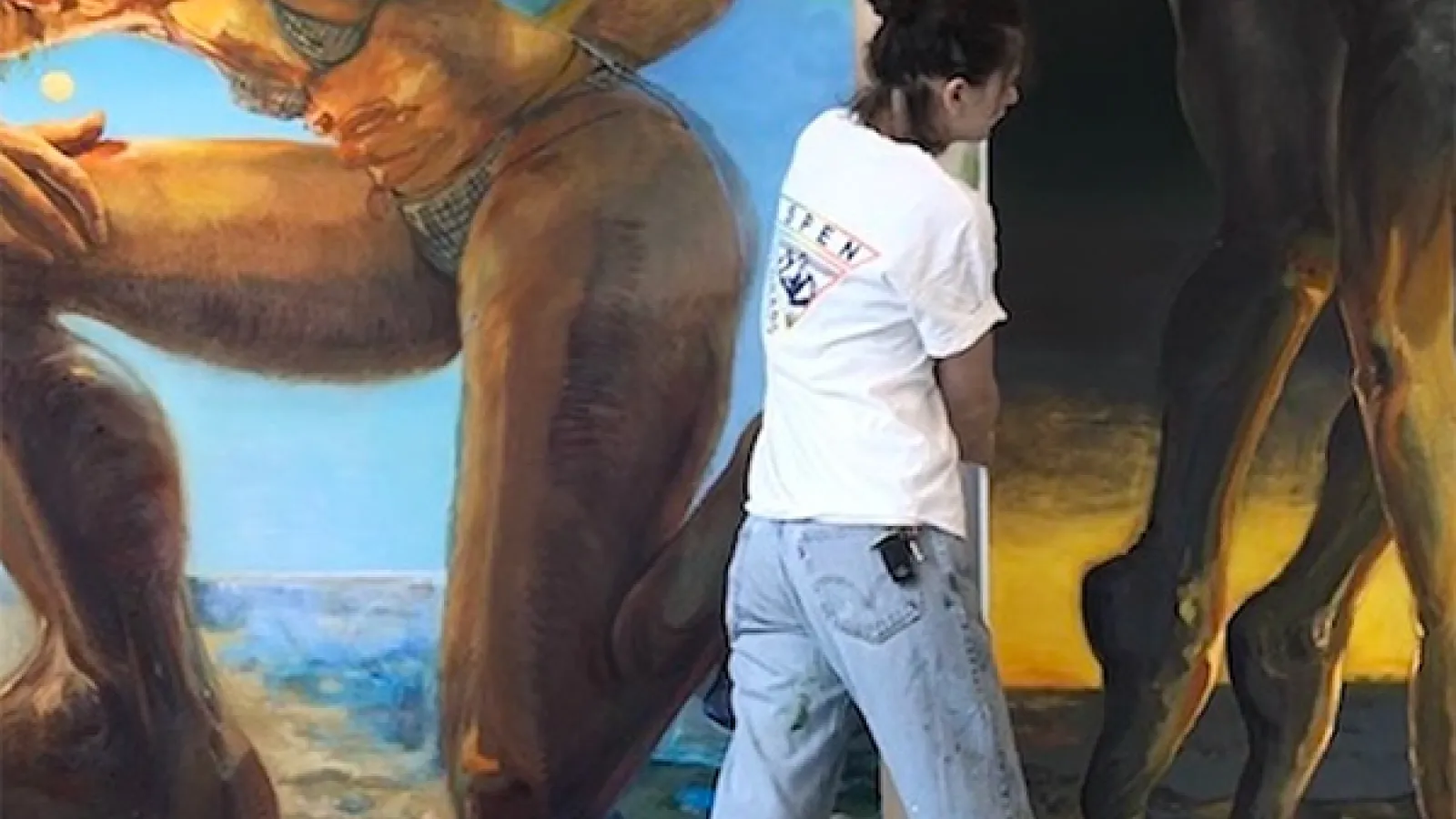Chantal Wnuk holding onto her oil paintings