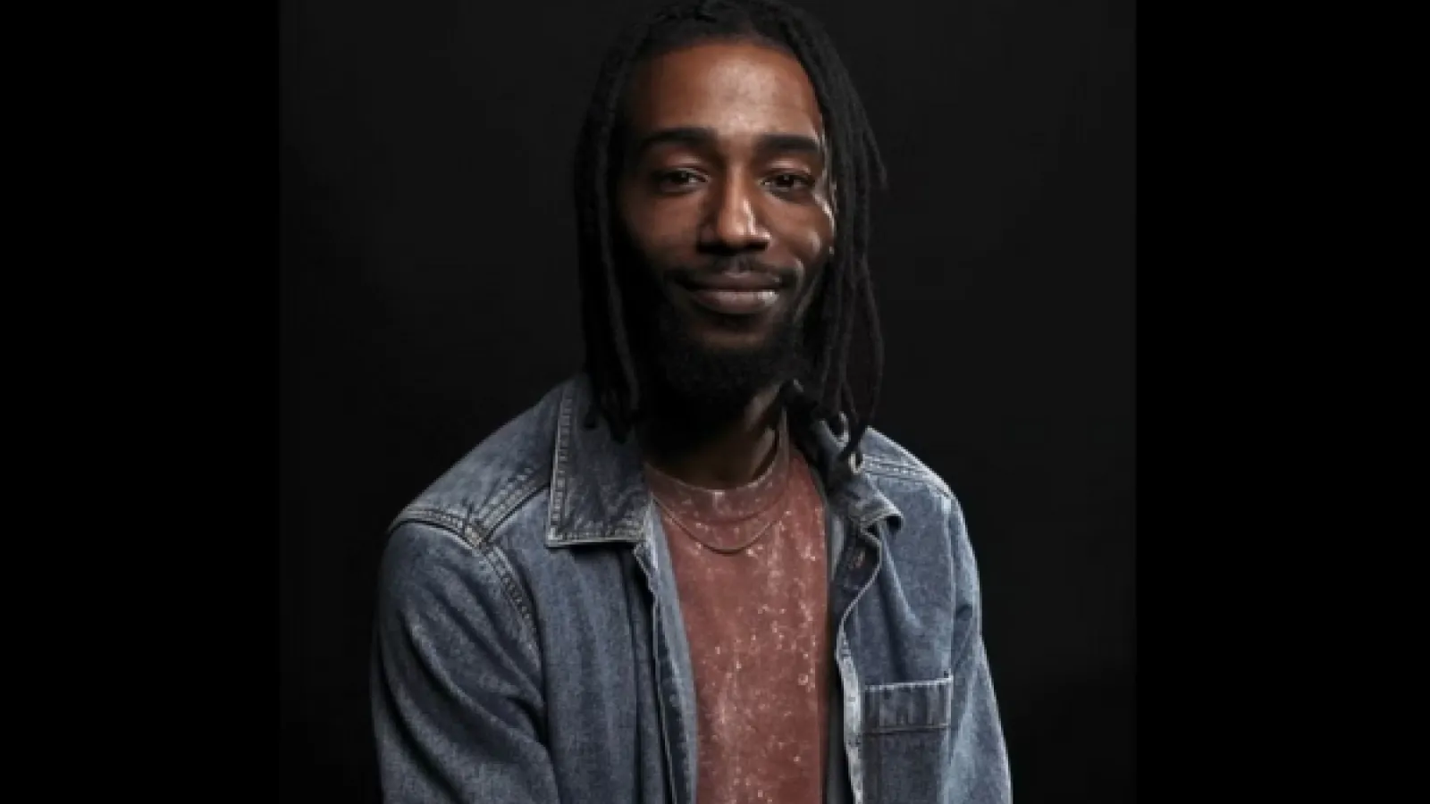 Photo of Arris' J. Cohen in a jacket