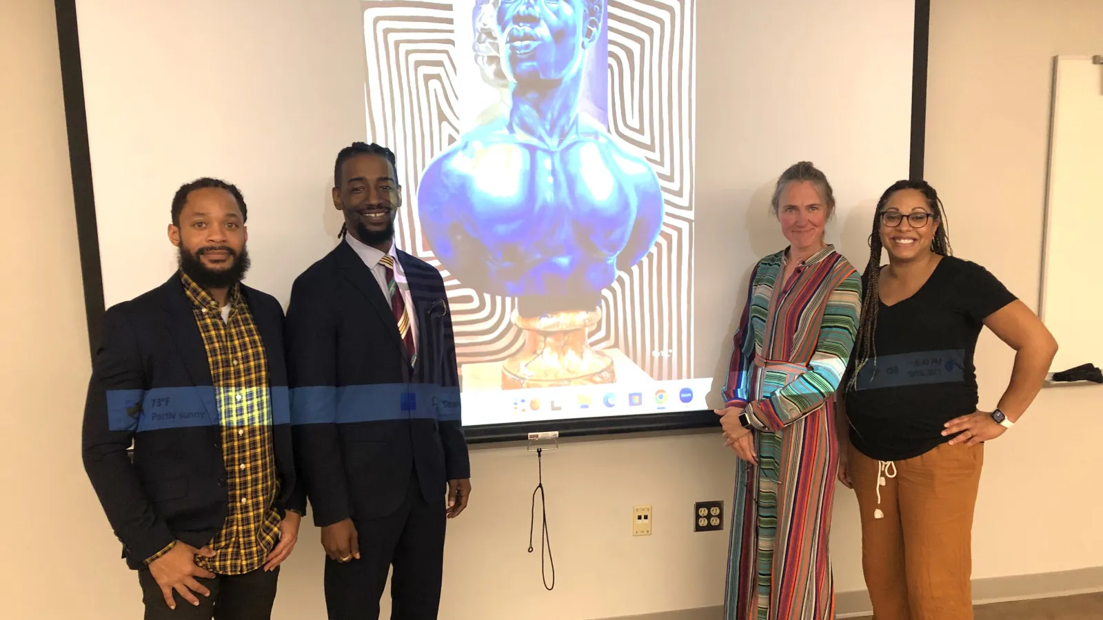 Terron Banner (left), Arris' J. Cohen, Merijn van der Heijden and Monica Stigler are pictured in front of a slide of Cohen's work.