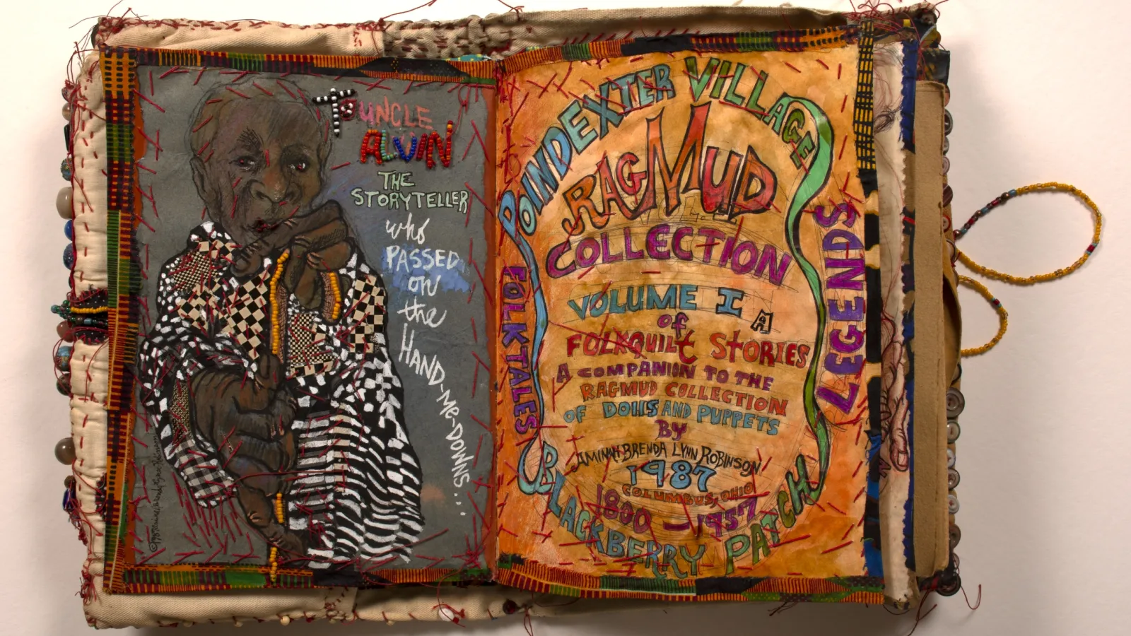 a cloth journal by Aminah Robinson with the words Ragmund Collection at the top