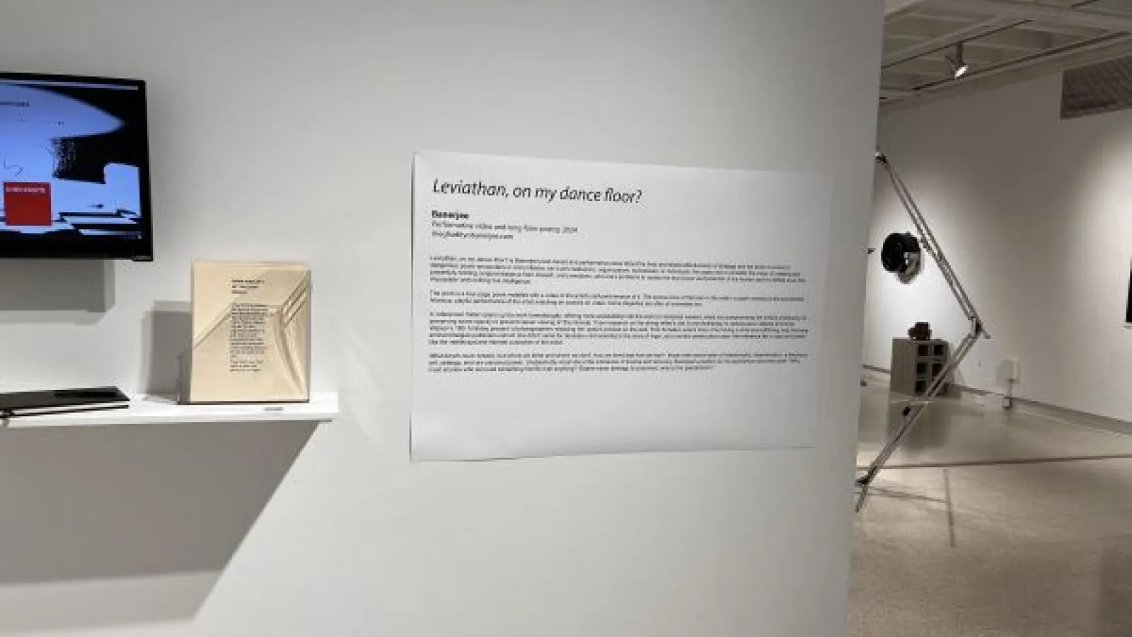 A photo of Banerjee's artist statement on the wall in Hopkins Hall Gallery  