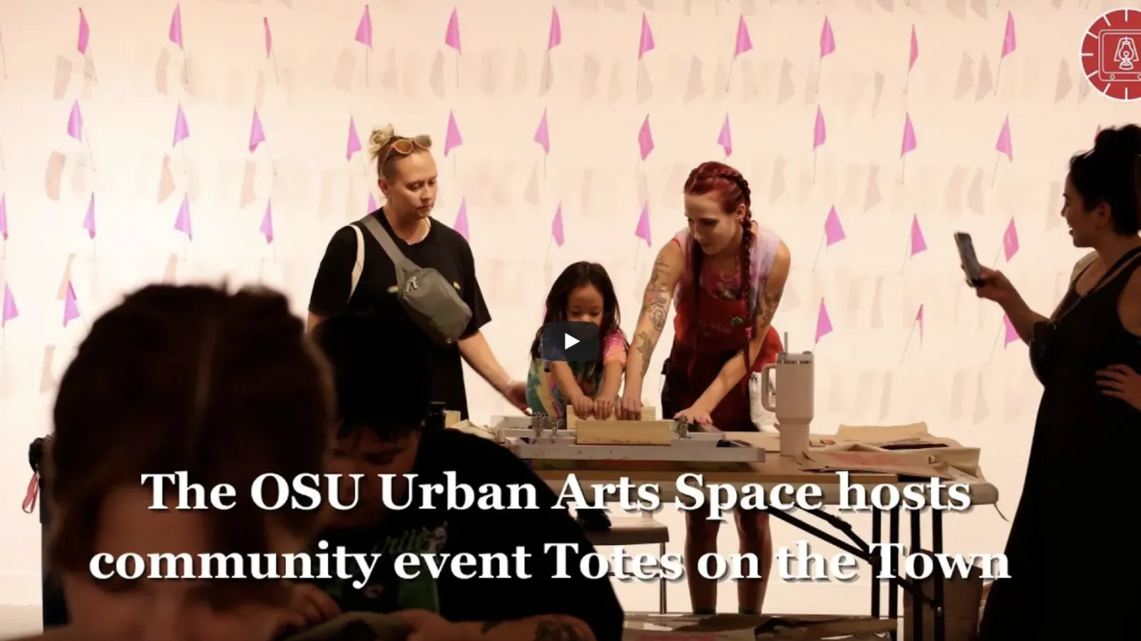 The OSU Urban Arts Space hosts community event Totes on the Town (overlaid on photo of artists screen-printing tote bags)