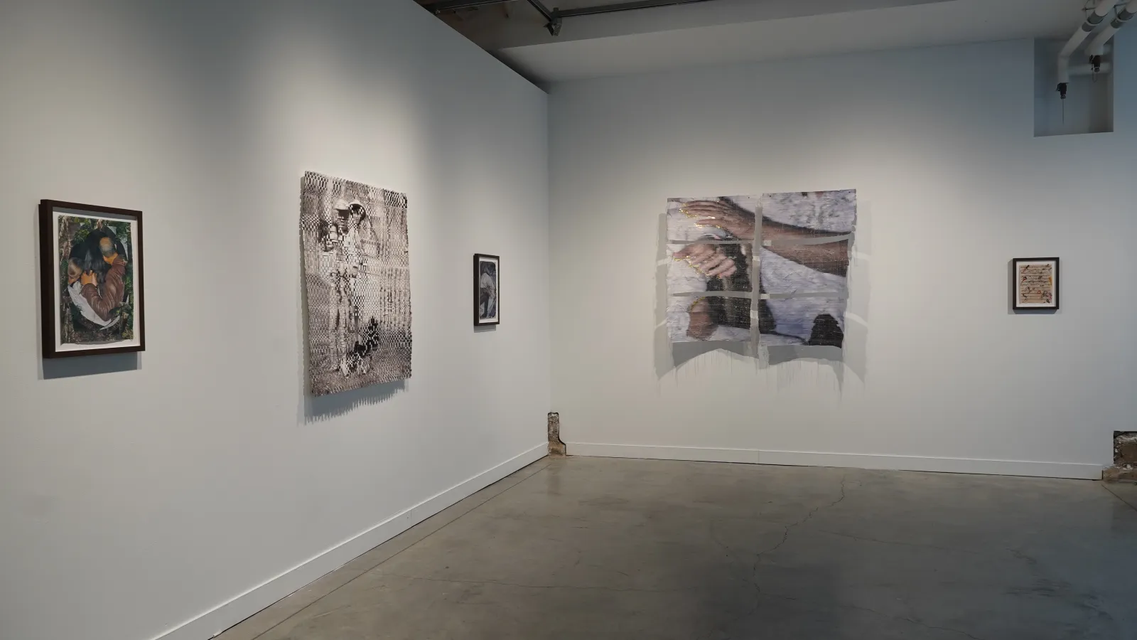 artwork on the walls at Urban Arts Space, including collage weavings