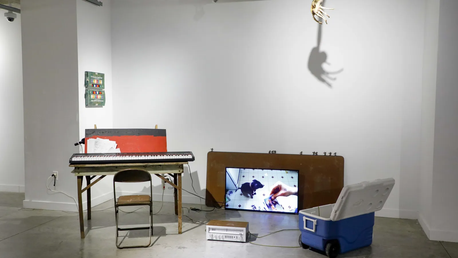 an eclectic collection of objects, including a piano keyboard and a TV