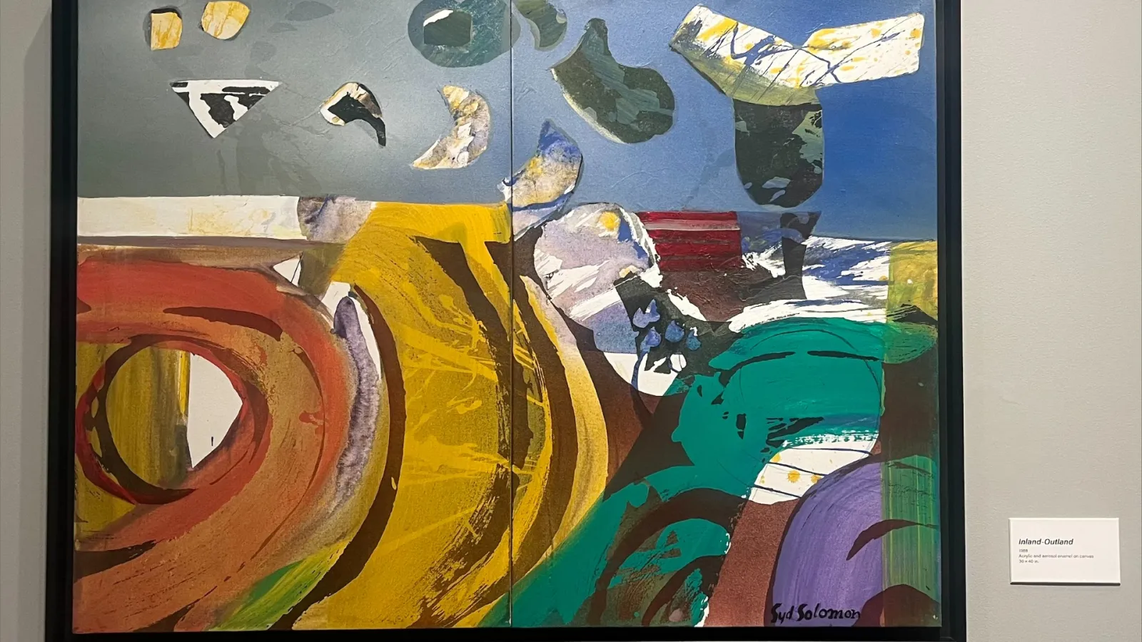 Syd Soloman's painting "Inland-Outland" featuring colorful geometric shapes.