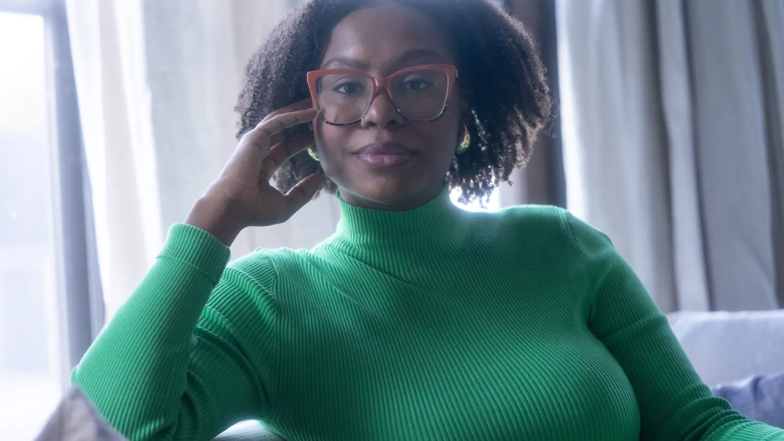 photo of ajanae in a green sweater