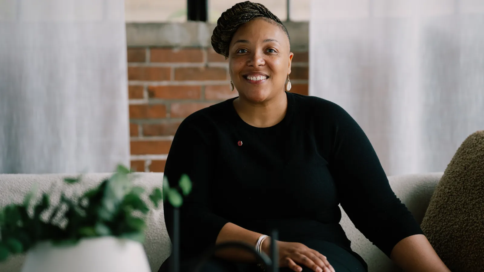 tyiesha smiling in a black sweater