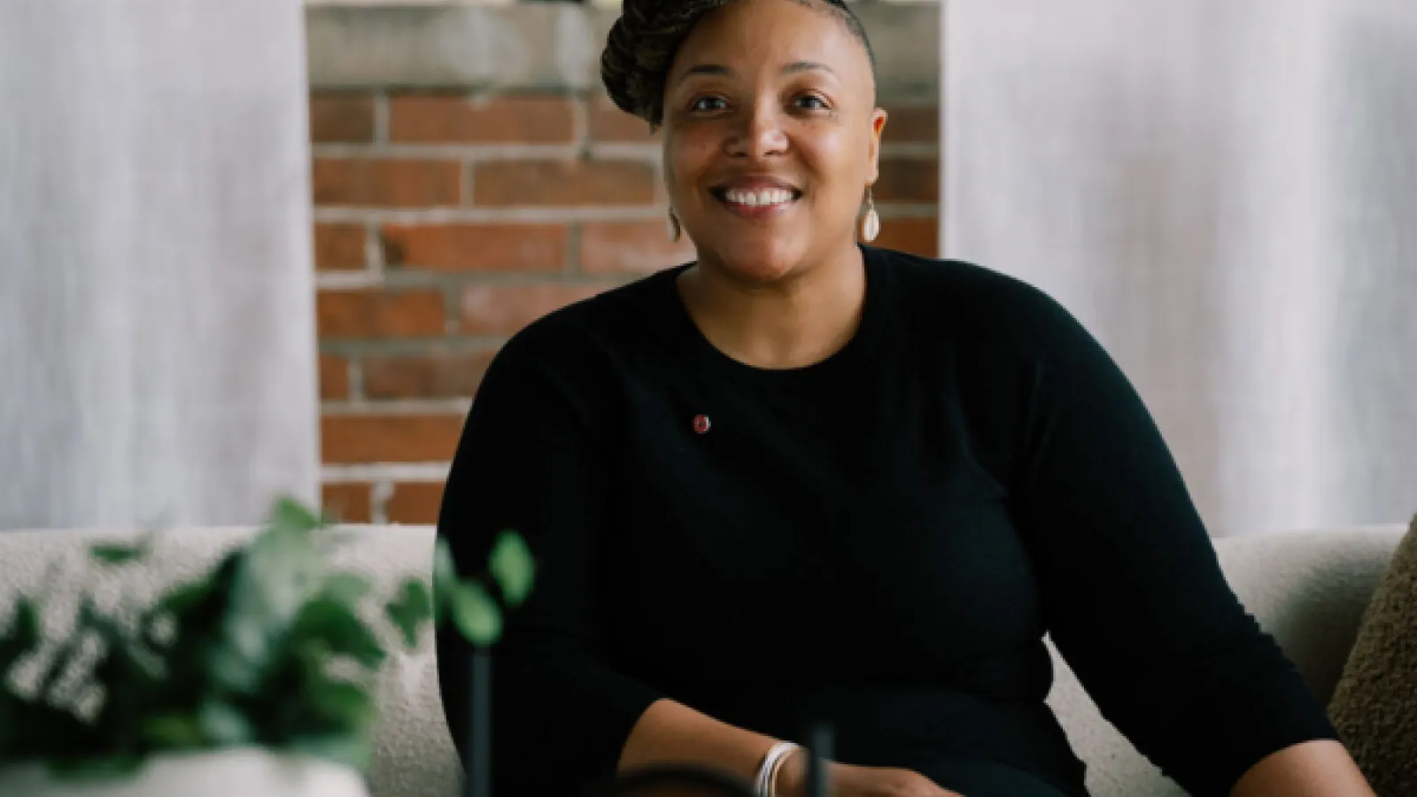 tyiesha smiling in a black top