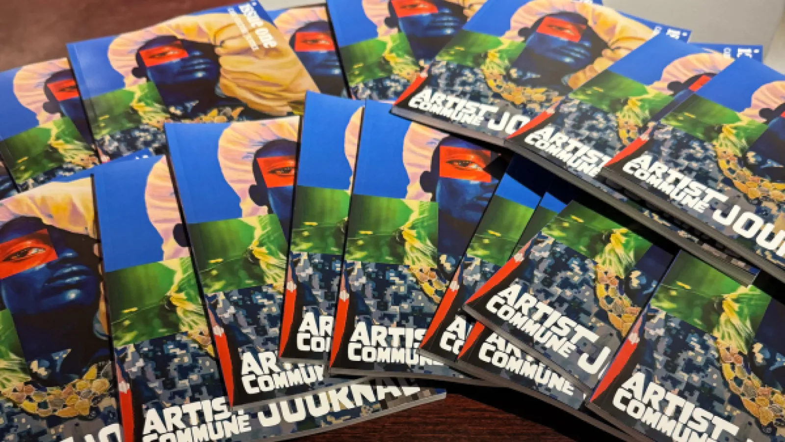 table covered in copies of the artist commune journal