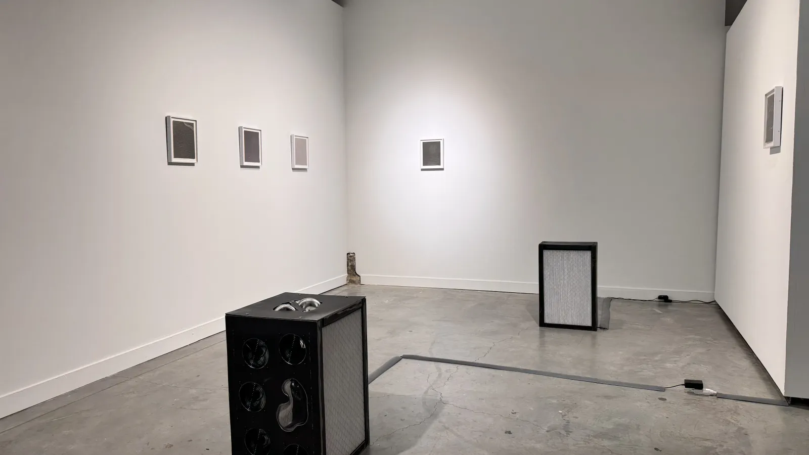 gallery space with air filters and photograms
