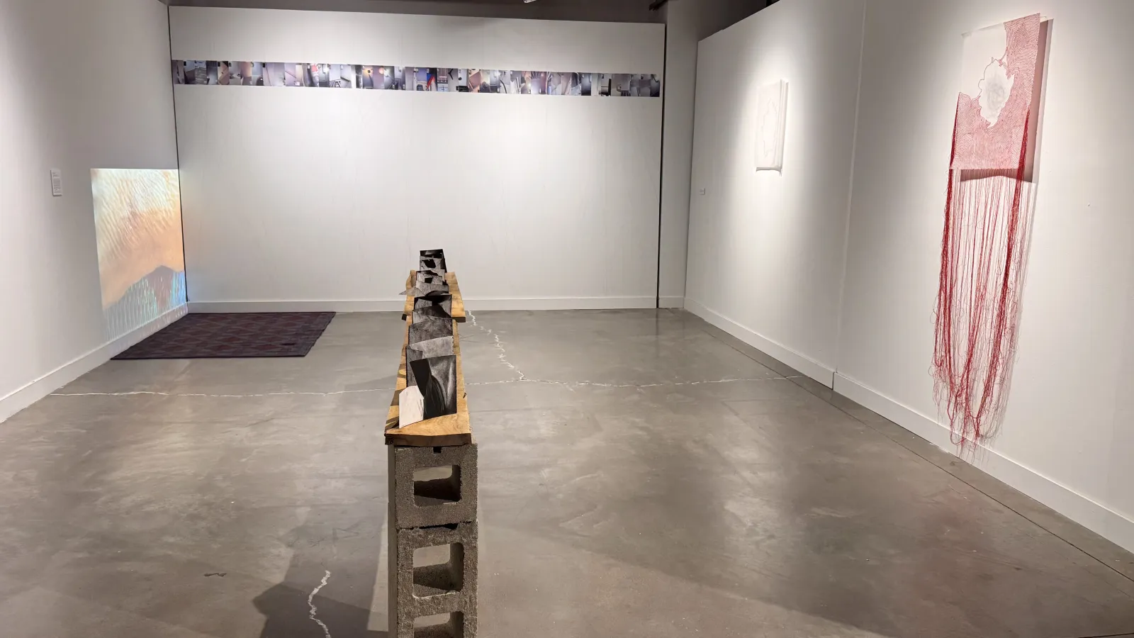 gallery space with yarn and abstract sculptures
