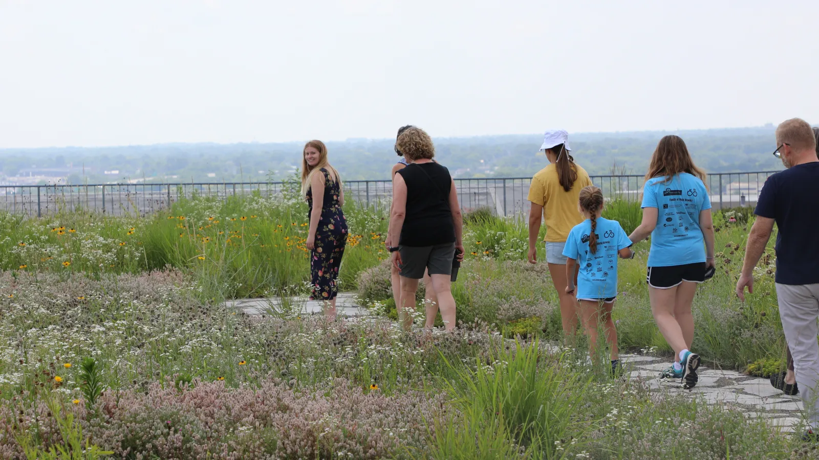 An intern leads a Rooftop Garden Tour.