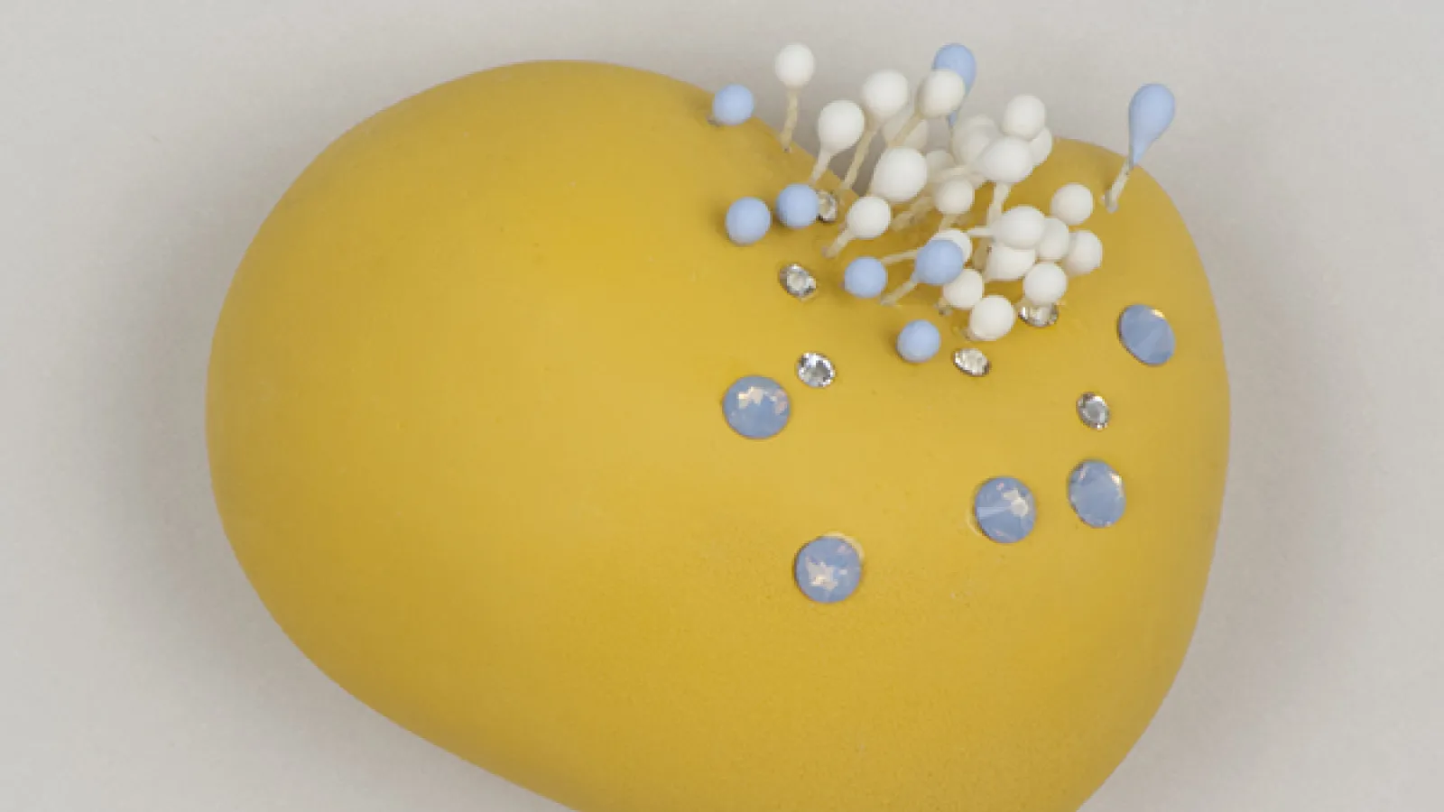 Bethany Haeseler: "(will this define you?)," shadowbox, cast plaster, Swarovski crystals, artificial stamens, paint, 2014