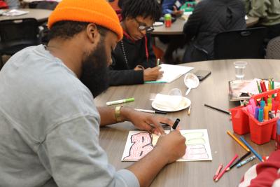 participant drawing at the event