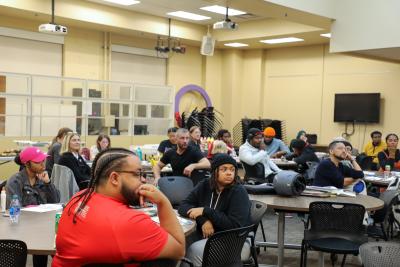 crowd listening to Arris' speak at the Hale Center