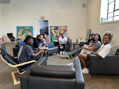 Arris' and his friends gathered around in chairs at Wild Goose