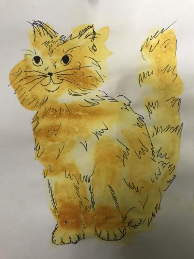 A painting of a cat created with yellow turmeric paint