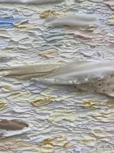 Close up of fabric art piece by Madeline with purple, white, and beige fabric