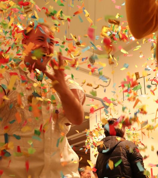 John excited as confetti is thrown around him