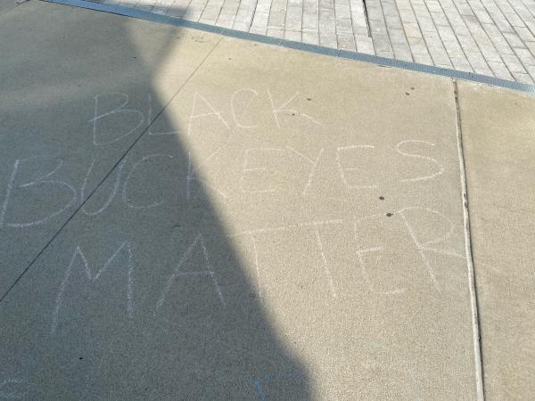 Black Buckeyes Matter written in chalk on sidewalk 