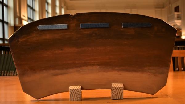 A front shot of a MANU Board sitting upright.