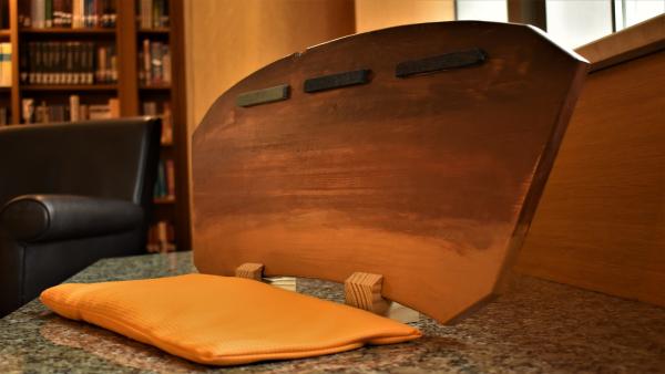 A side shot of a MANU Board sitting open.