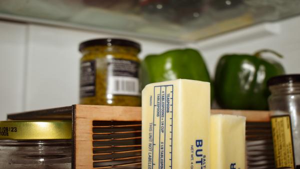 A close-up shot of ingredients sitting on top of a LAYRS shelf stand.